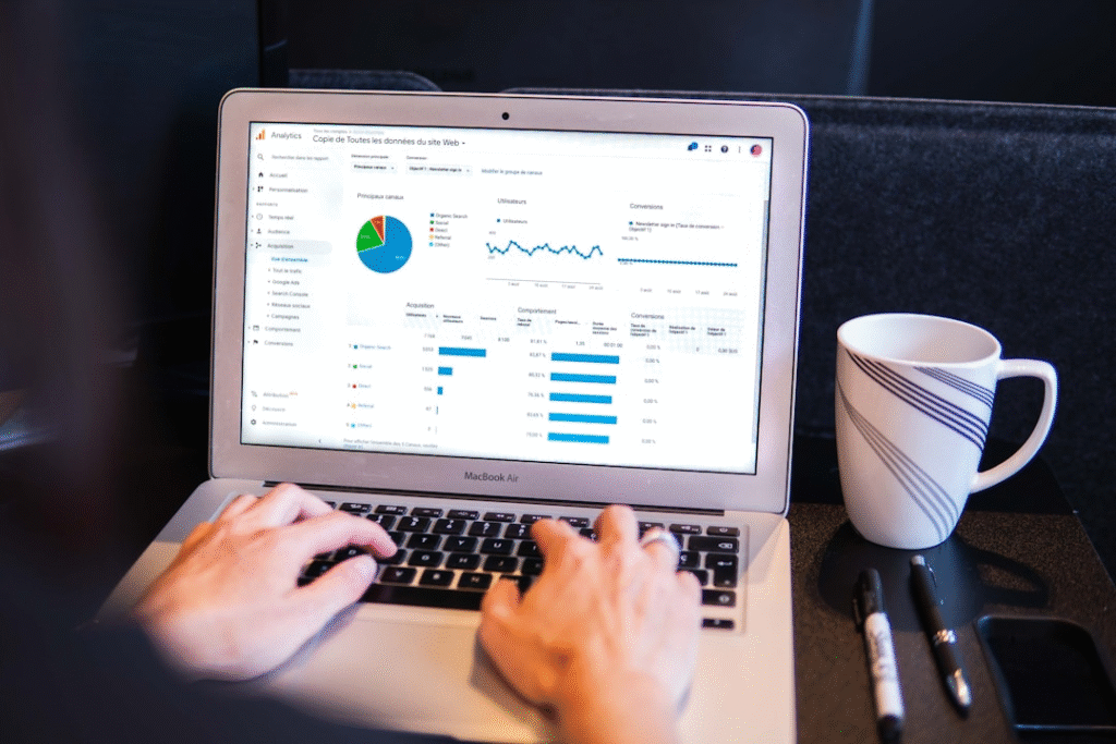 Person reviewing what is RFP software on a laptop and how to best use its analytics